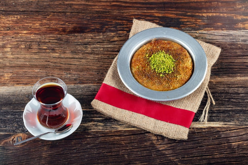 Künefe is a crispy cheese-filled dessert made with kadayıf, which is a traditional shredded wheat dessert with pistachio filling.